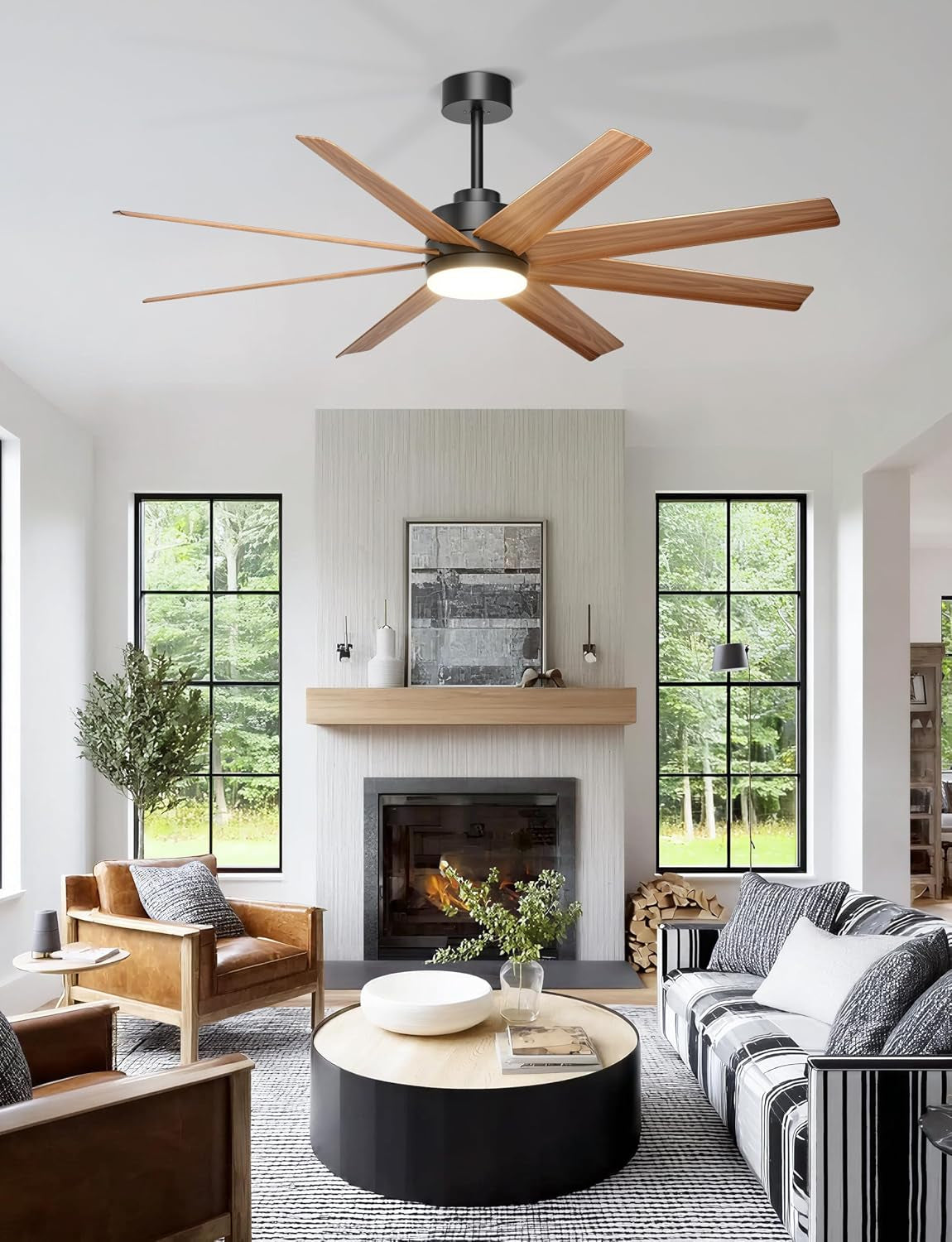 Wood-grain eight-blade fan installed over a contemporary living room with fireplace and large windows