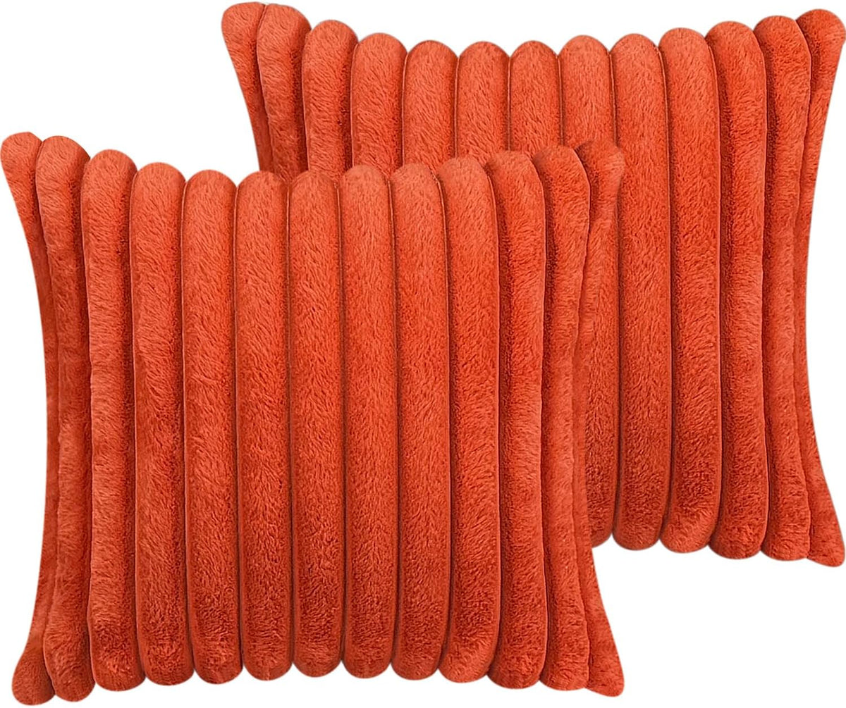 Pair of square faux-fur pillow covers in bright orange with thick vertical ribbing