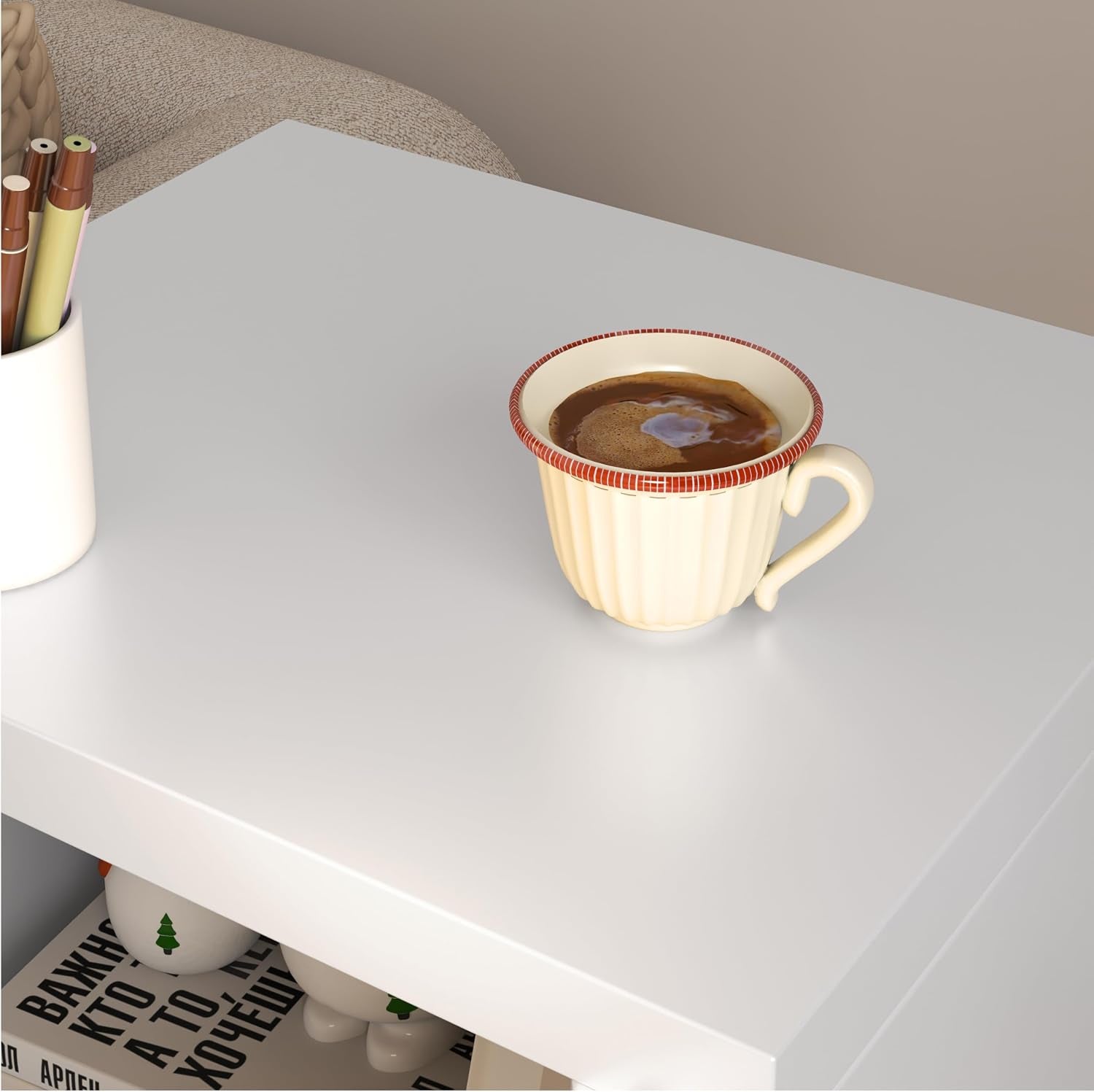Close-up of smooth white locker top with a cup of coffee and pen holder nearby