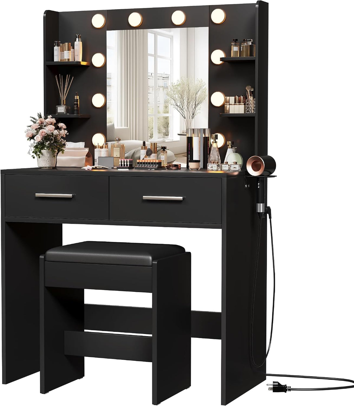 Black vanity desk with illuminated mirror bulbs, two drawers, side shelves, bench and attached hair dryer.
