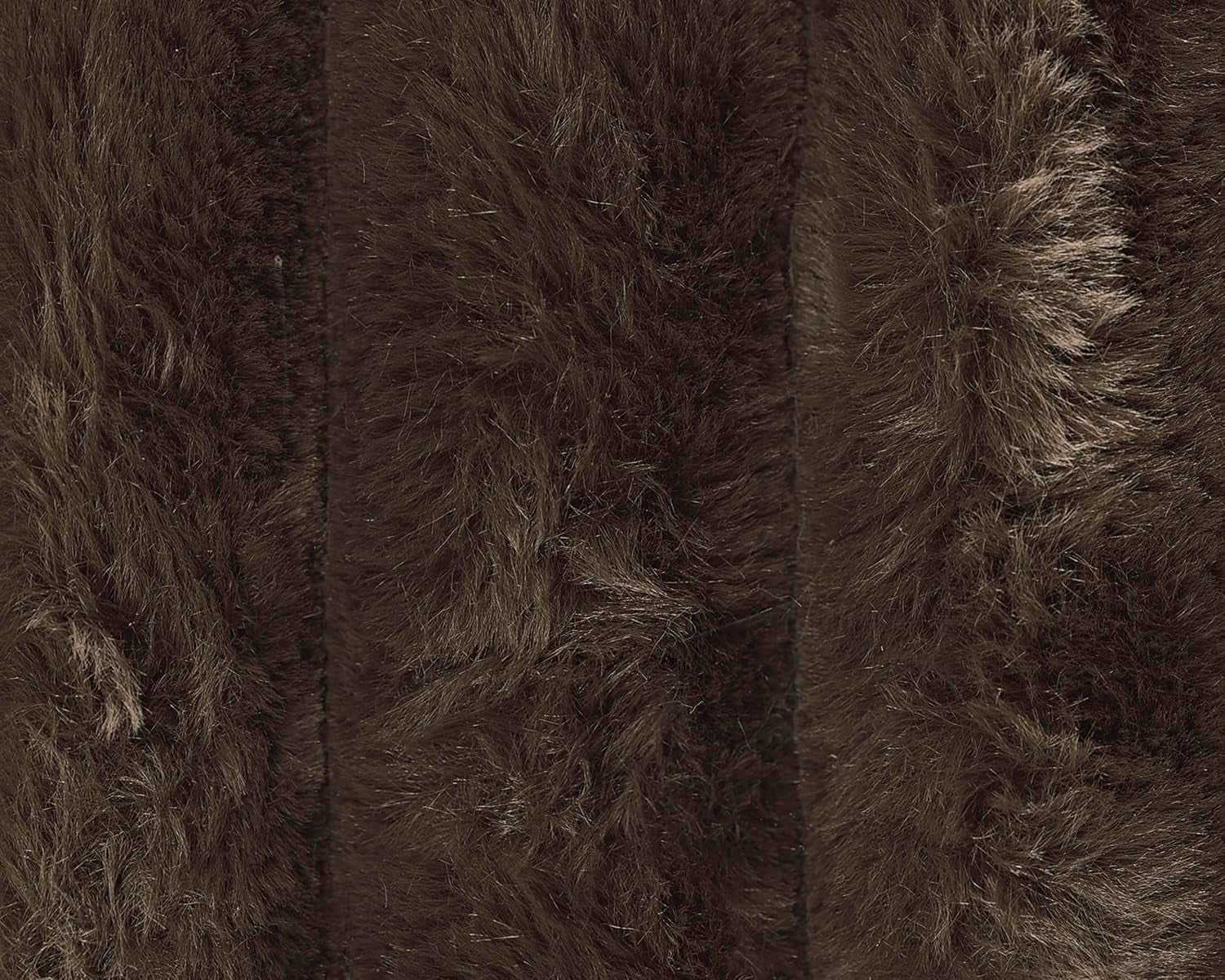 Close-up of plush jumbo corduroy pile showing deep chocolate-brown textured ribs