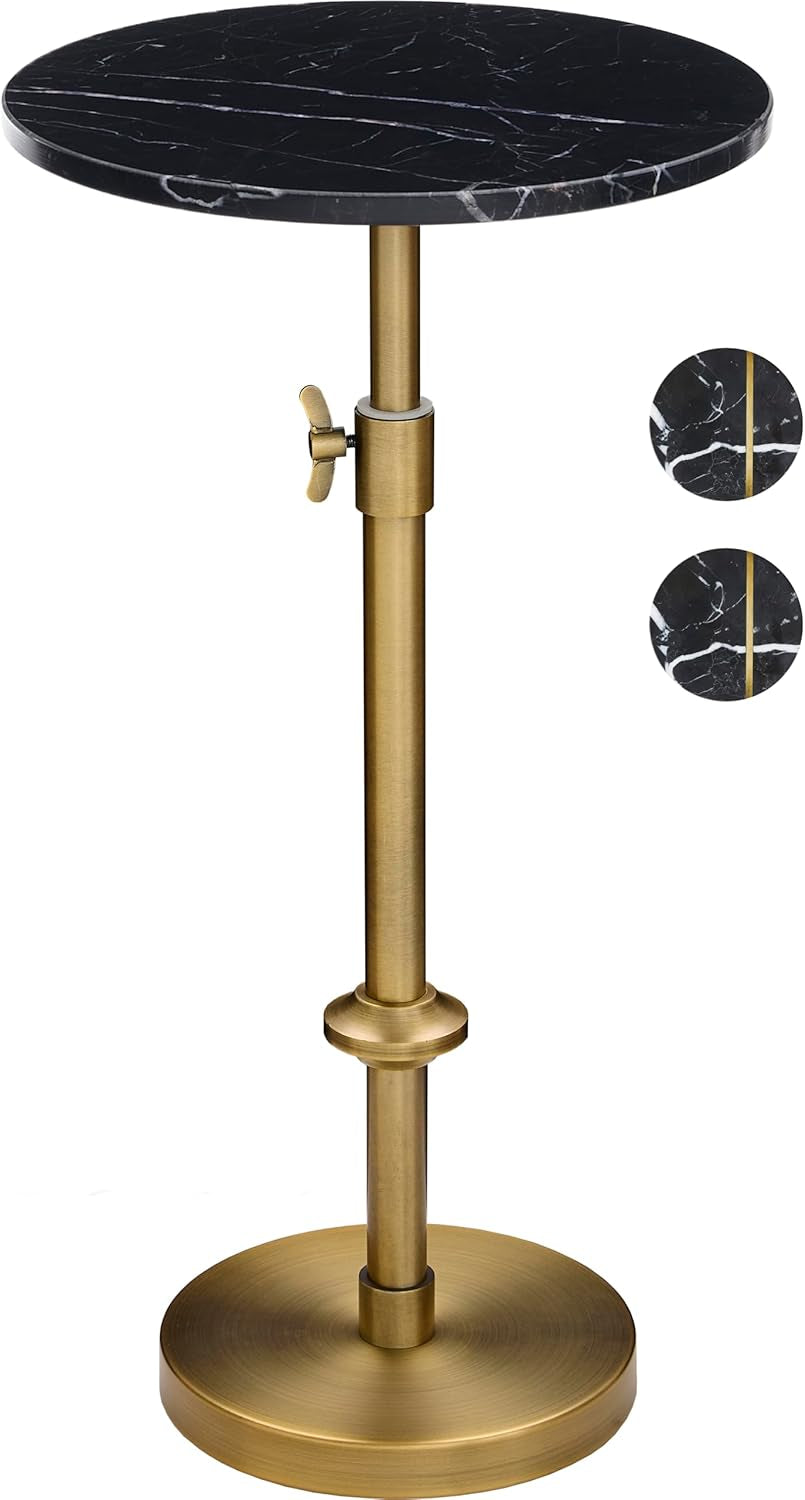 Studio view of round black marble top drink table with antique brass pedestal and visible adjustment knob.