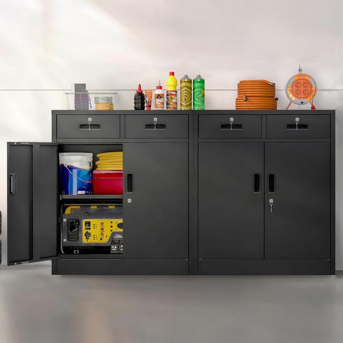 Front view of a black metal storage cabinet set, left door open showing tools and supplies inside