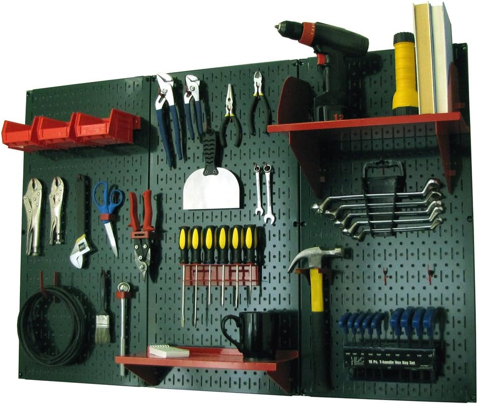 Black metal pegboard with red shelves and hooks holding wrenches, screwdrivers, drill, hammer and cups