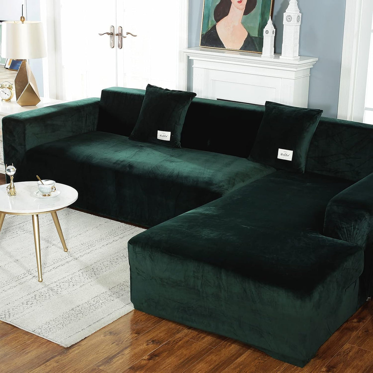 Three-quarter view of dark green velvet L-shaped sectional in a bright living room