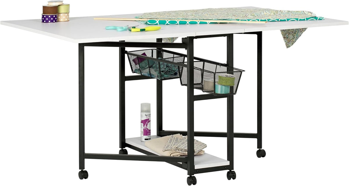 White fold-out tabletop on a black metal frame with two mesh baskets and a lower shelf on casters.