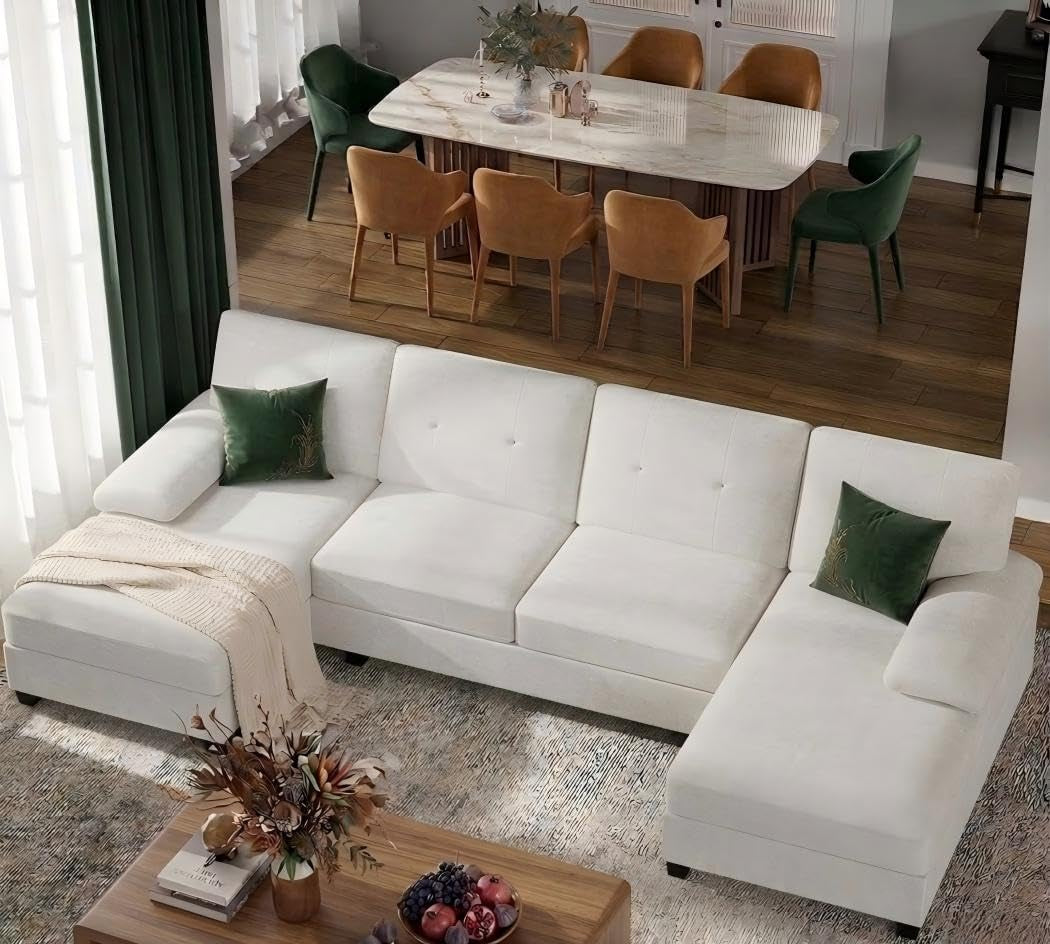 White U-shaped sectional with double chaise staged in a dining-adjacent room.