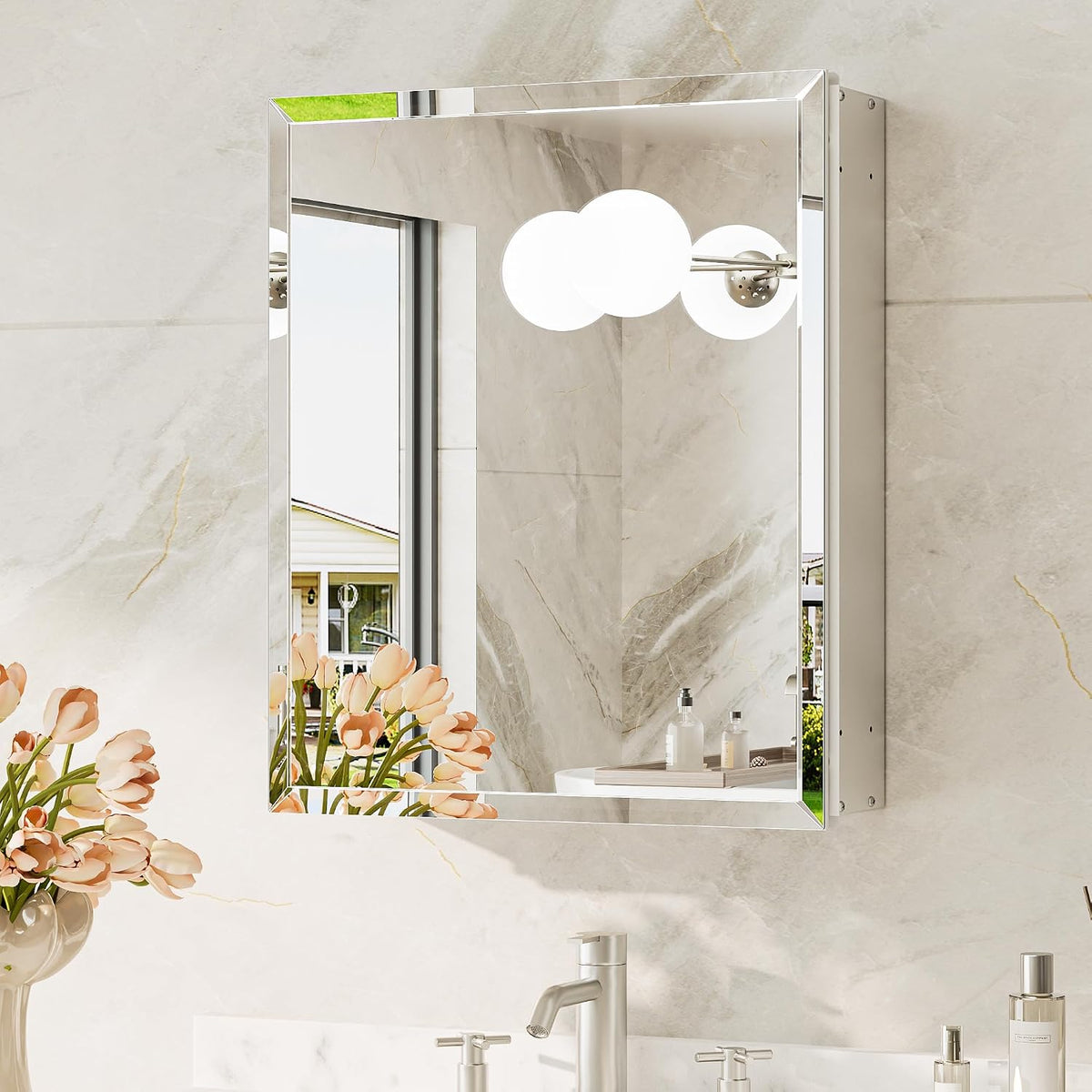 Single mirrored cabinet door reflecting a window, round vanity lights, and a vase of tulips