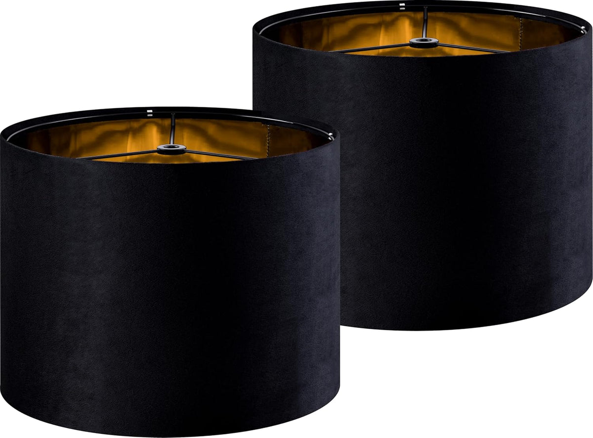 Pair of black drum lampshades with gold metallic inner lining, shown from a slight top angle.