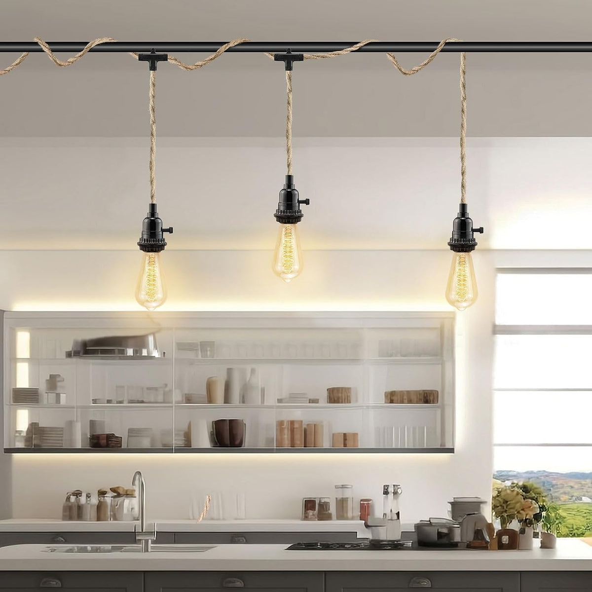 Three hemp-rope pendant lights with lit bulbs hanging over a kitchen island