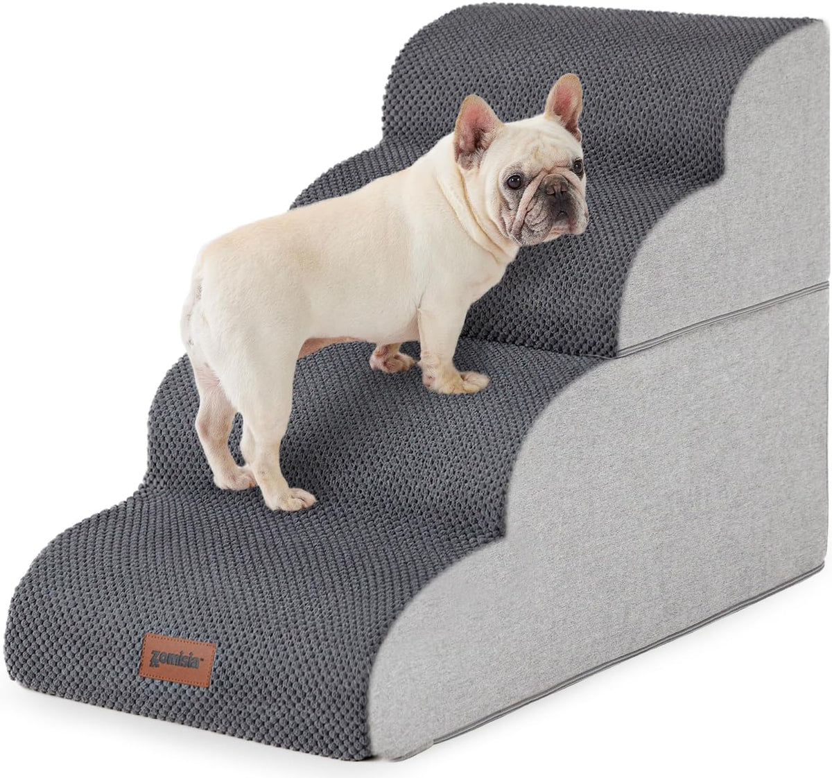 Cream-colored French bulldog on dark gray textured three-step pet stairs with light gray sides