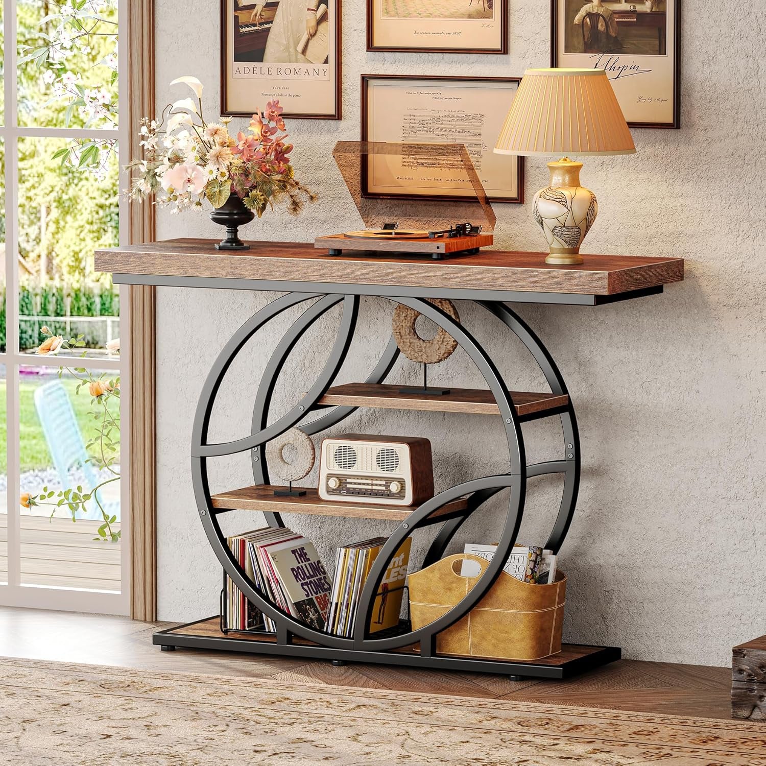 Styled foyer scene showing the rustic brown console with a record player, radio, and framed art above.