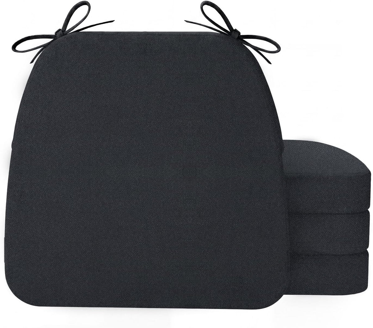 Front-facing dark charcoal D-shaped cushion with a three-cushion stack peeking out from the right side.