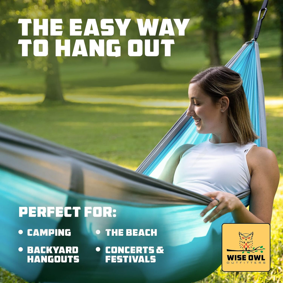 Woman lounging in a turquoise hammock in a sunlit park with a relaxed expression and close-up framing