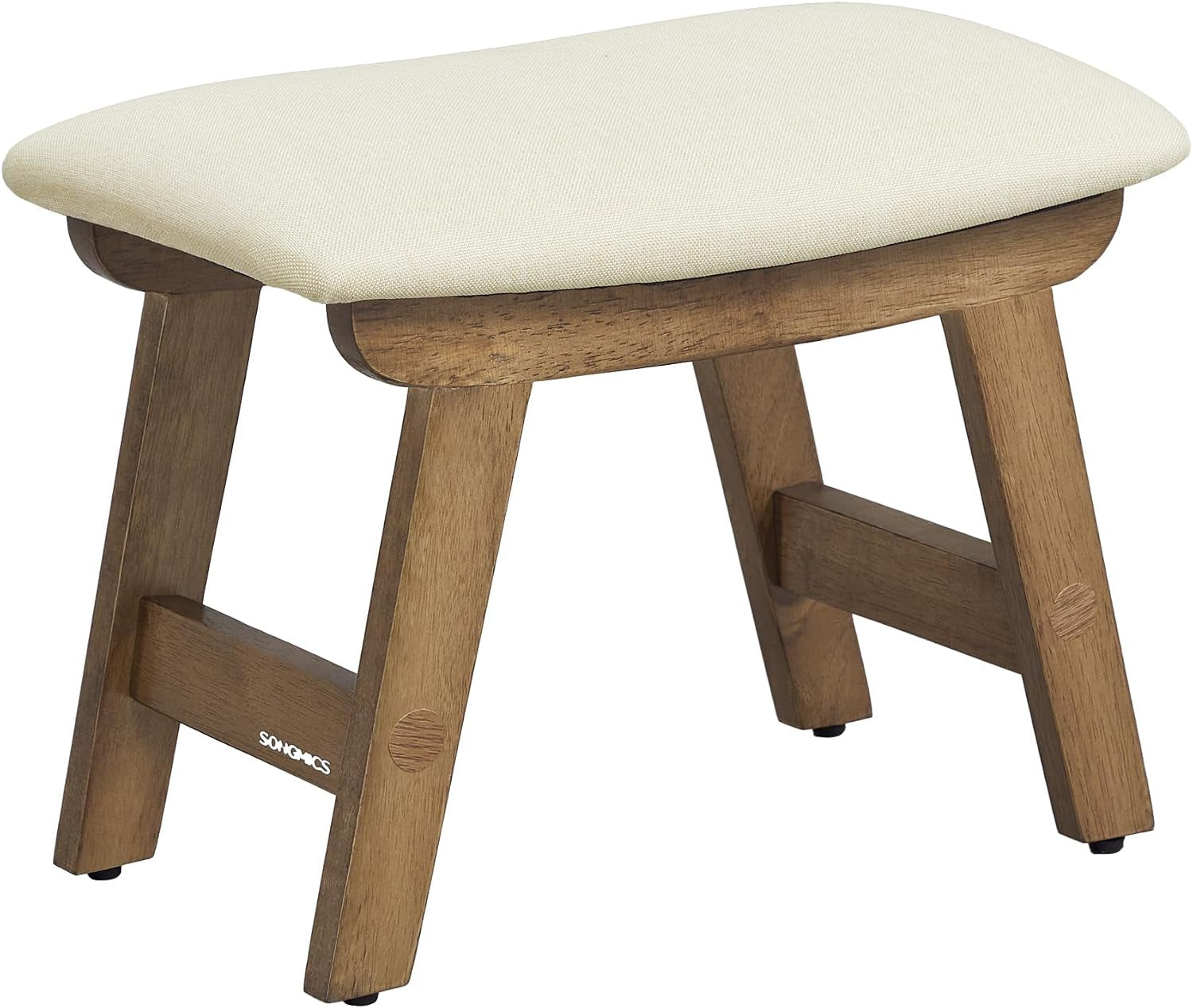 Low wooden stool with angled legs and a padded cream fabric seat
