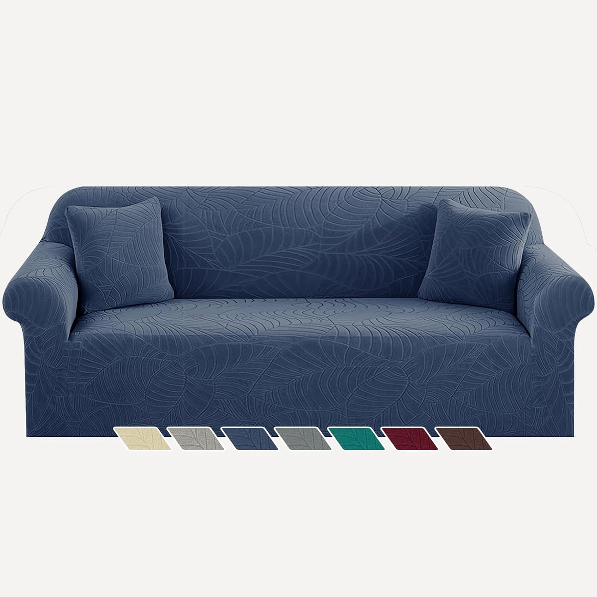 Front view of a three-seat sofa in a deep navy jacquard slipcover with matching pillows.