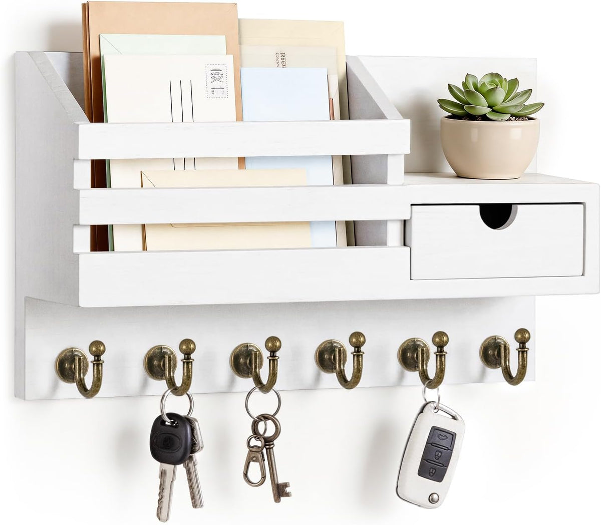 Front view of white organizer with envelopes in the slot, potted succulent on top and keys hanging below.