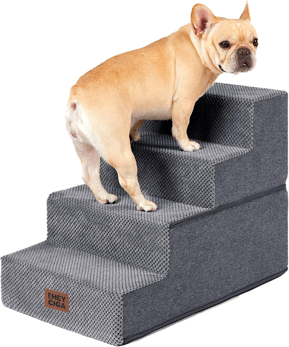 Front three-quarter view of grey four-step foam pet stairs with a small fawn French bulldog standing on the steps
