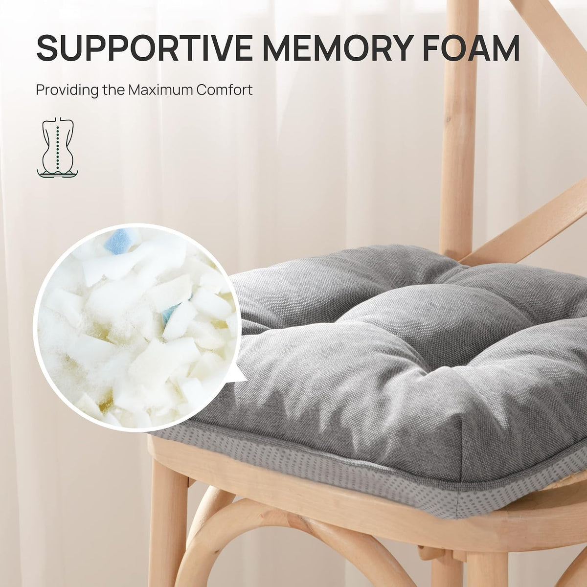 Close-up of a gray tufted cushion on a wooden chair with circular inset showing shredded foam fill