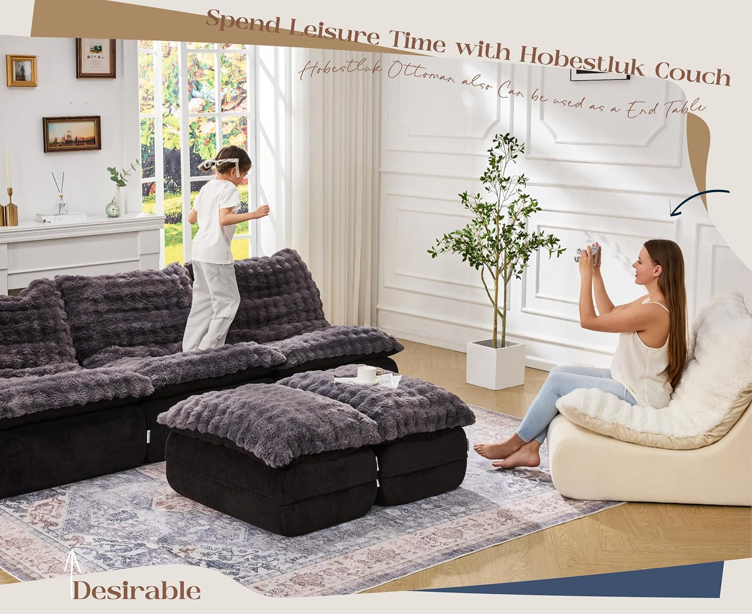 Wide view of modular floor sofa, ottoman pair center, woman seated on a light-side chair and child standing on sofa.