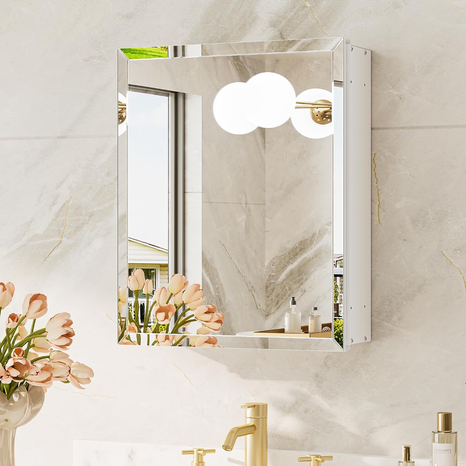 Wall-mounted mirror cabinet shown front-on with its white side panel visible and gold faucet below.