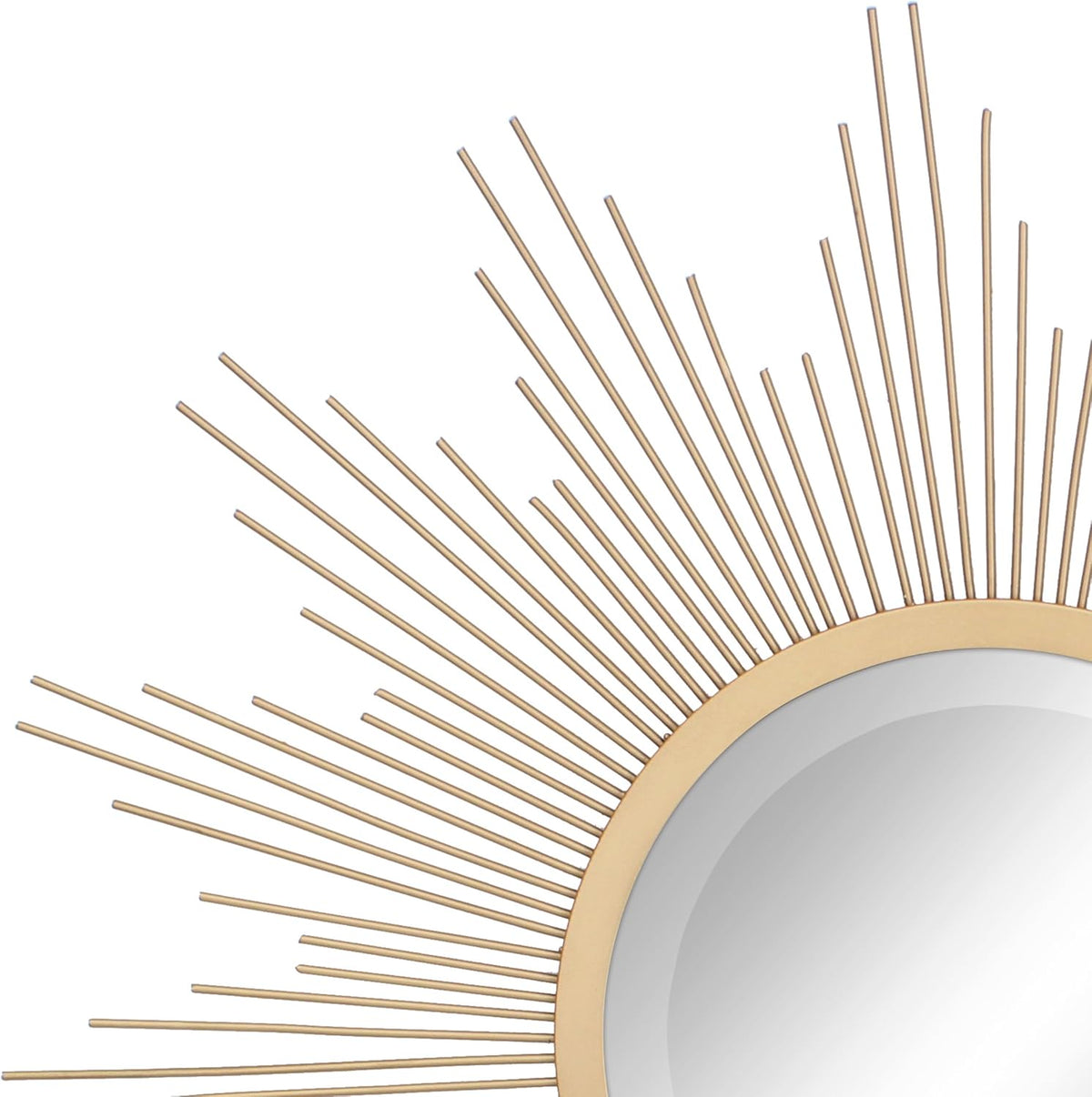 Close-up of antique gold metal rod details and the beveled edge of the round mirror