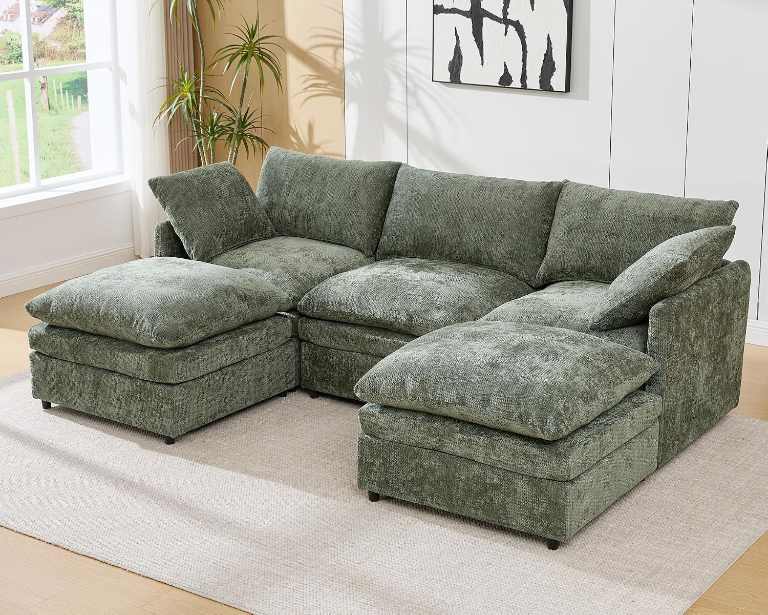 Green three-seat U-shaped sectional with two ottomans.