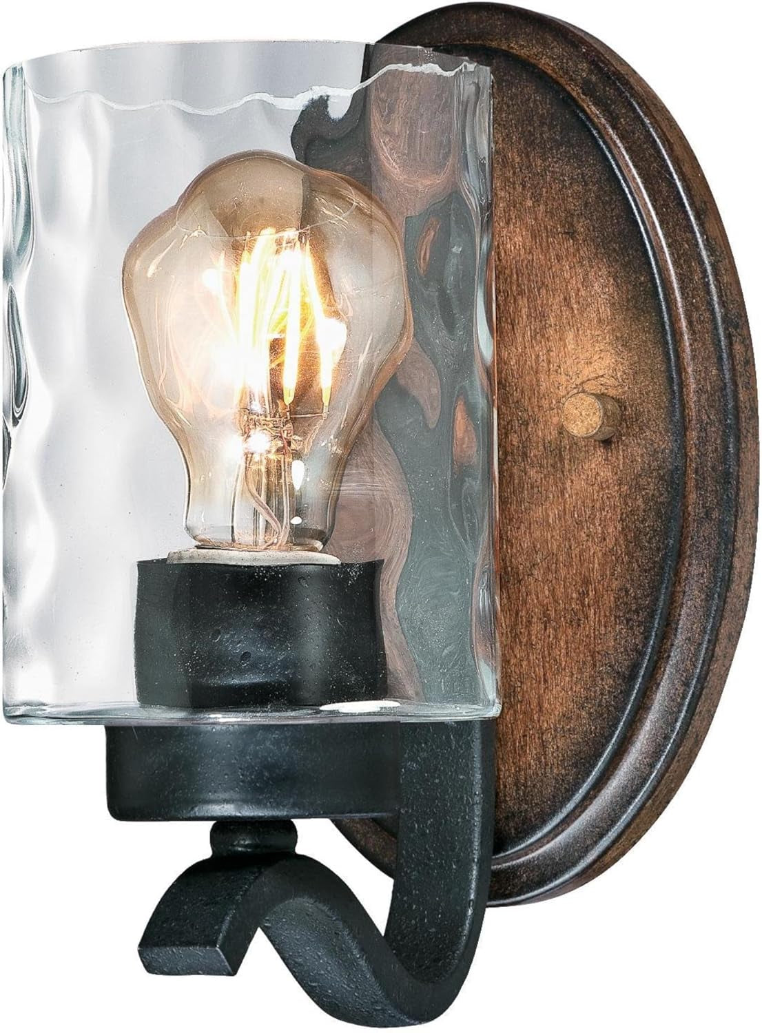 Clear hammered glass shade with lit filament bulb and wood-tone oval back plate at angled view