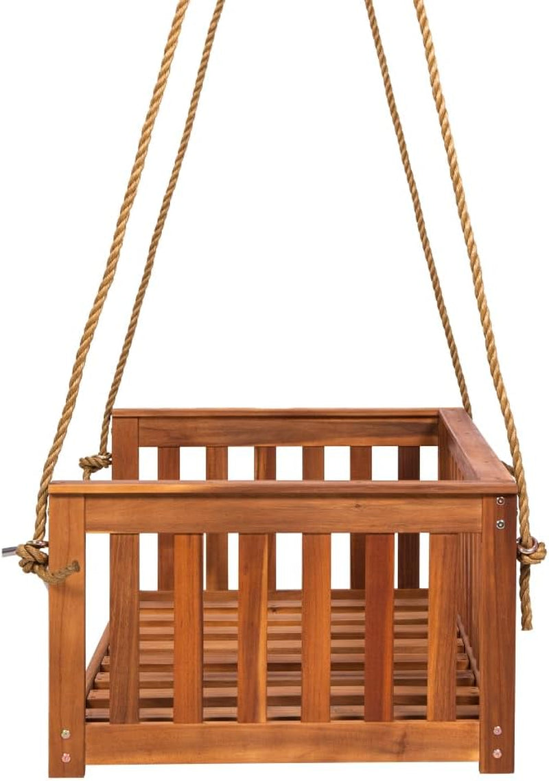 Front-facing view of the wooden crib-size swing bed suspended by thick natural ropes.
