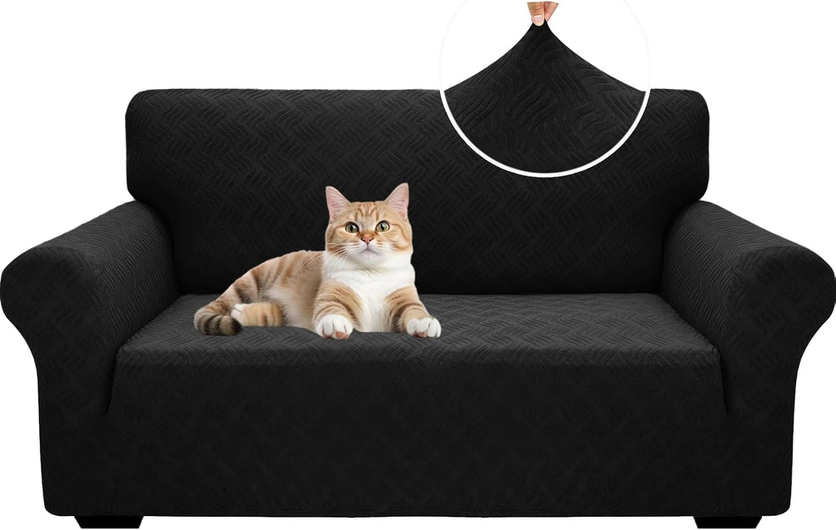 Black slipcovered sofa with a cat reclining on the seat and a circular inset showing stretched fabric.
