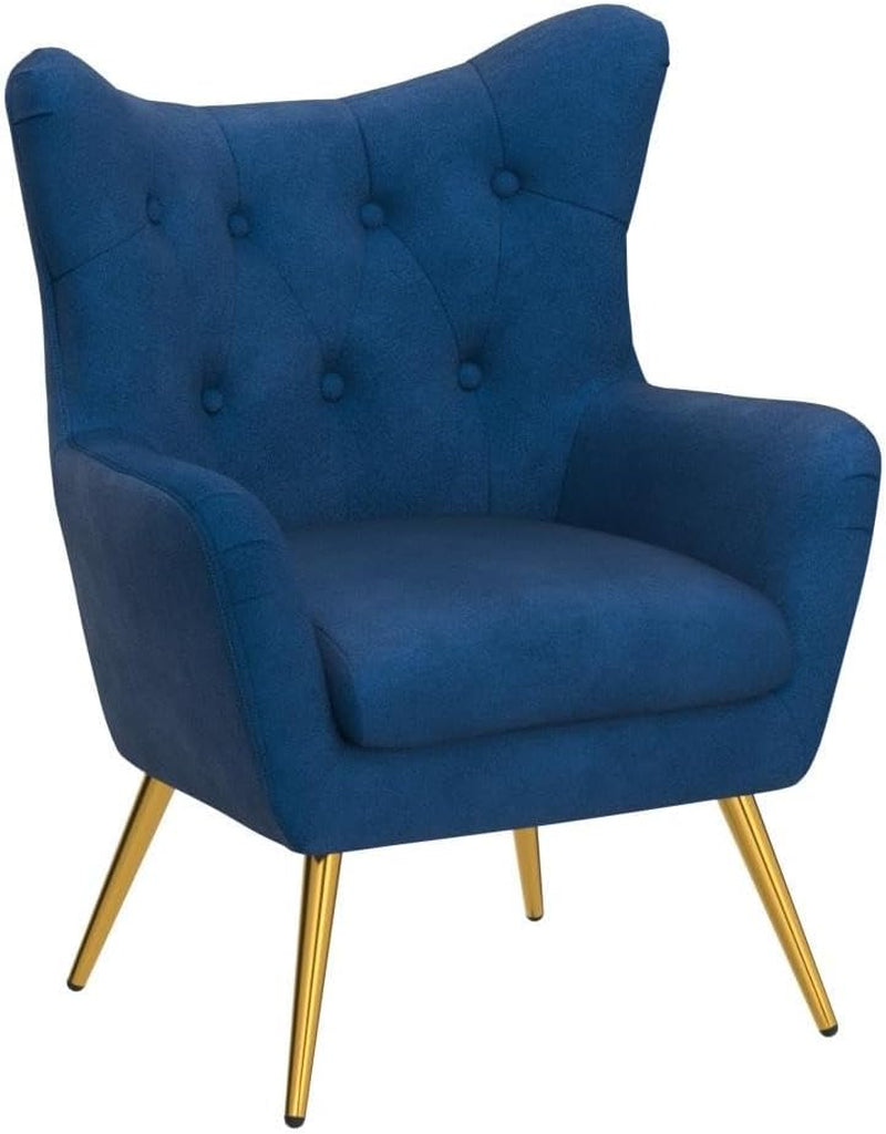 Front three-quarter view of a navy velvet wingback accent chair on a white background highlighting the shaped seat and gold-­