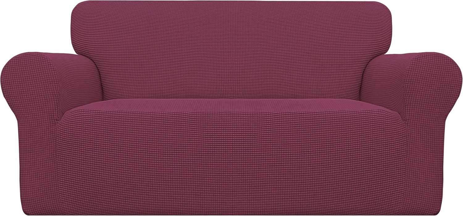Front view of a two-cushion loveseat fitted with a textured plum-colored slipcover