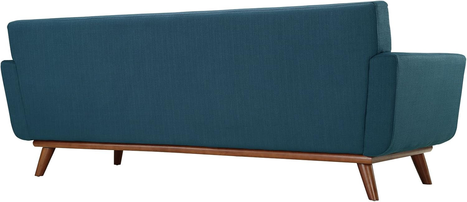Rear view of azure sofa showing straight upholstered back and cherry-colored wood base