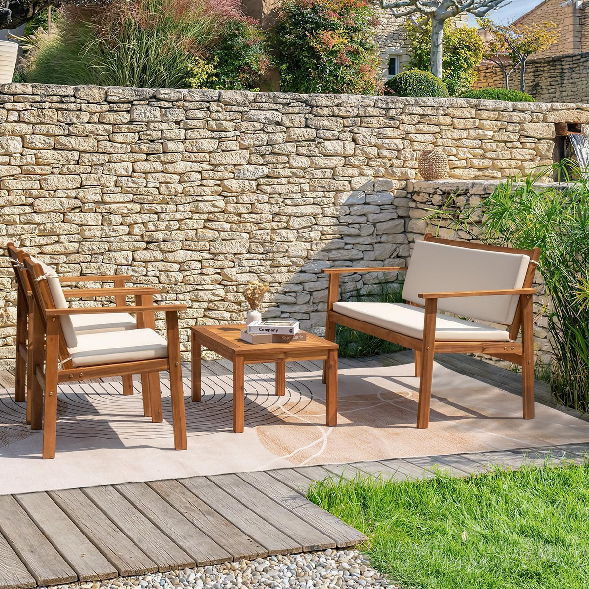 Outdoor acacia wood seating and slatted coffee table by a pool with white cushions, styled patio scene