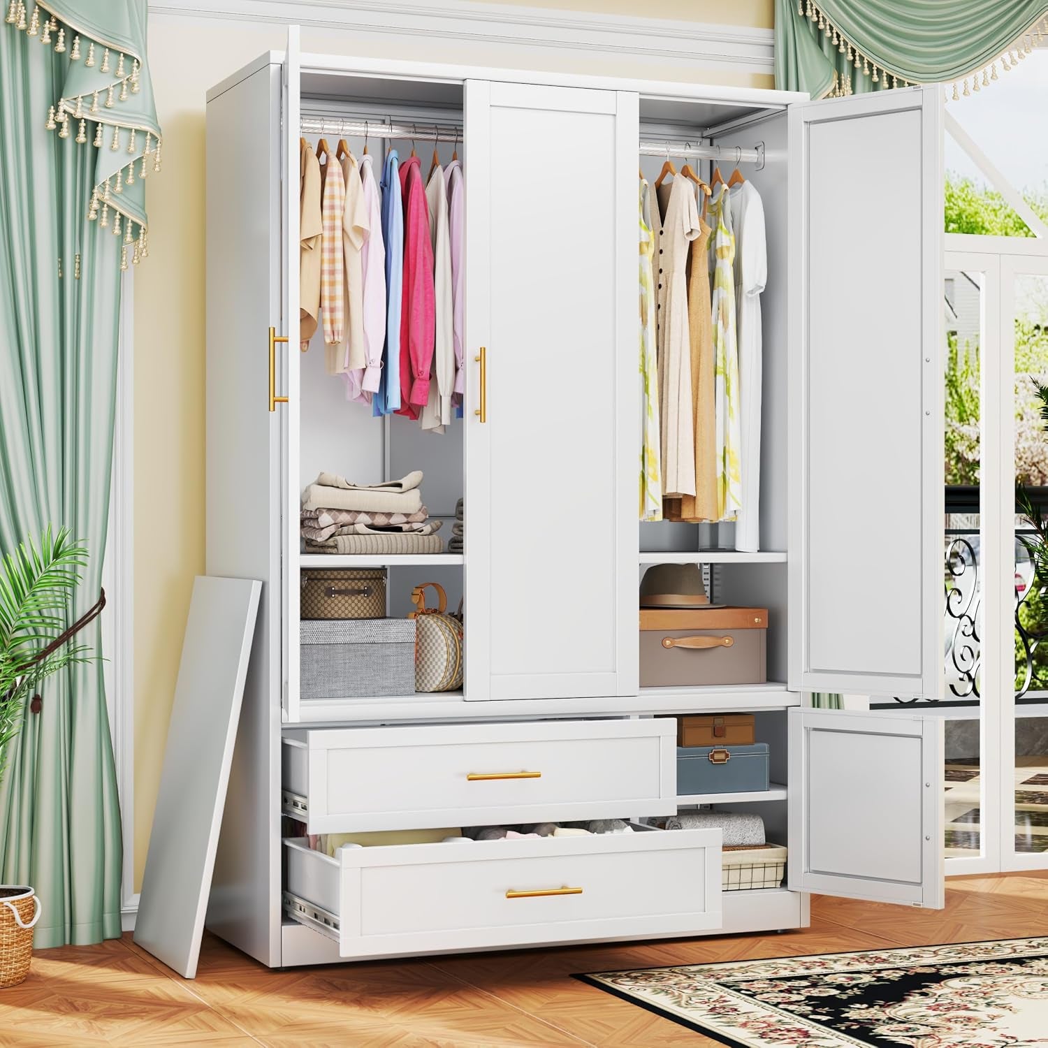 Close interior view of a white wardrobe with three doors open, two hanging rods, shelves and two pull-out drawers.