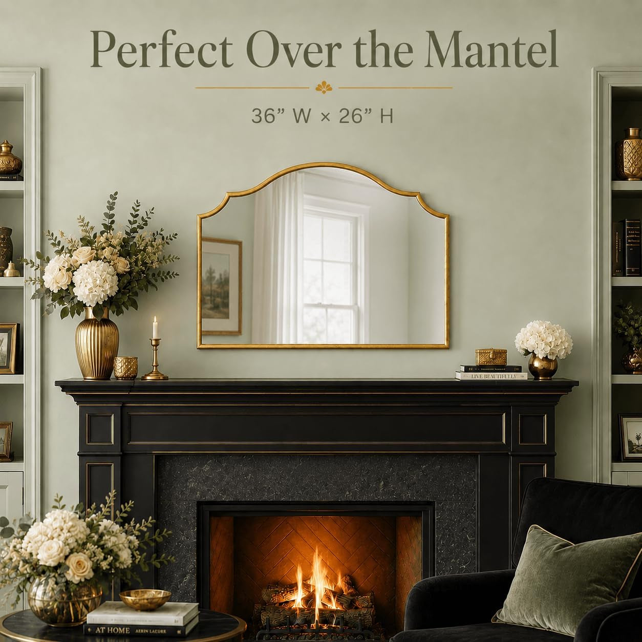 Gold scalloped arched mirror centered above a dark mantel in a styled living room setting with floral decor