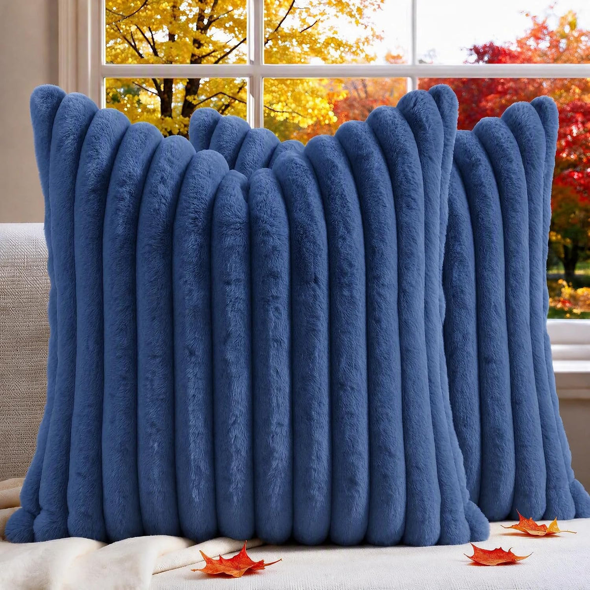 Close-up front view of a deep blue ribbed faux-fur pillow showing plush vertical channels.