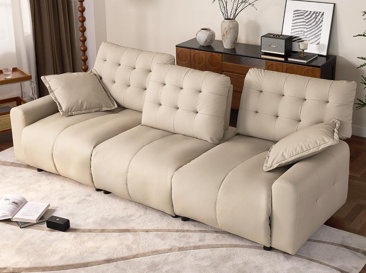 Three-quarter view of a beige oversized sectional arranged in a living room with two matching pillows.