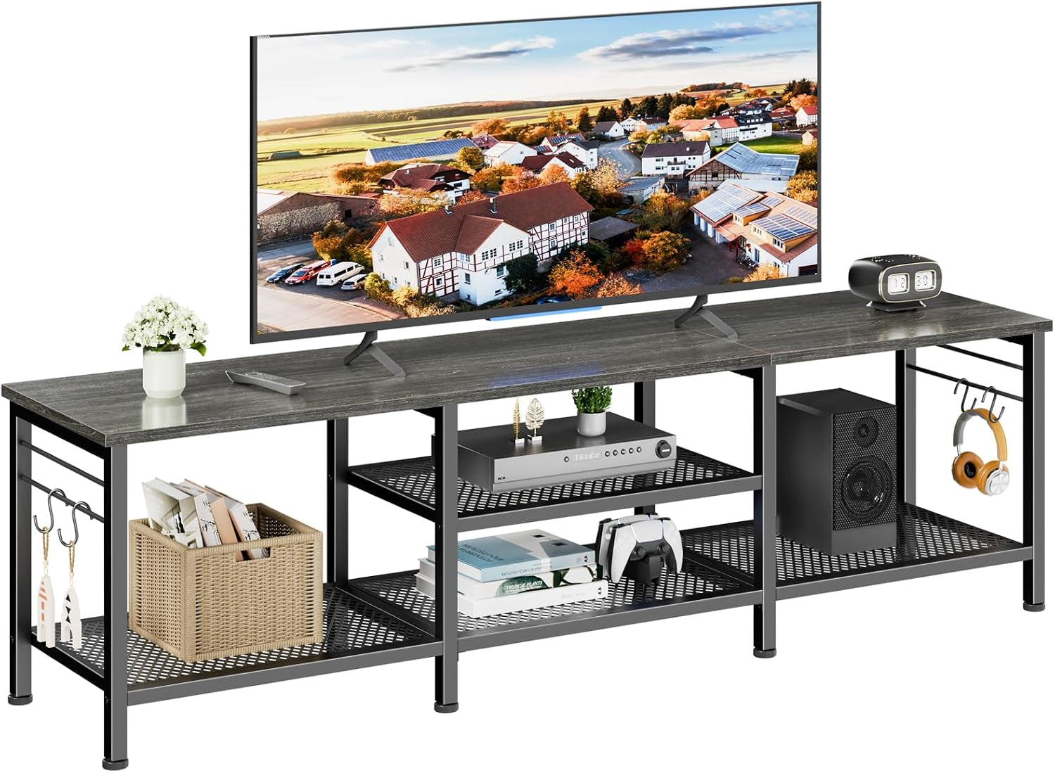 Studio shot of open metal TV console with dark gray top, mesh shelves and hanging hooks with accessories.