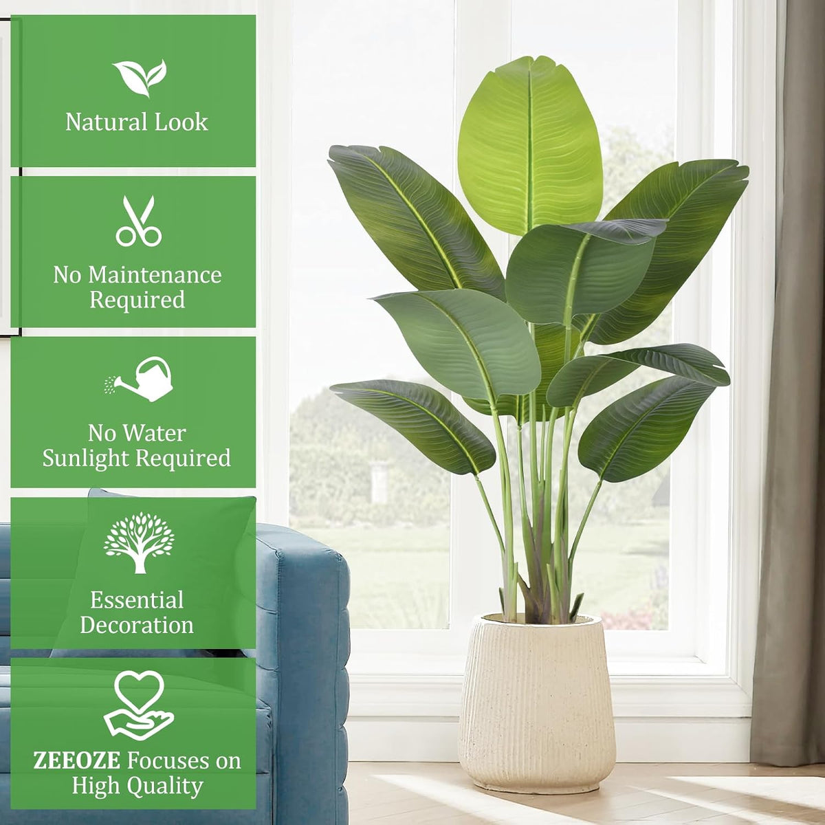 lifestyle room shot — the faux plant staged by a window next to a blue sofa in a textured white planter on a wood floor