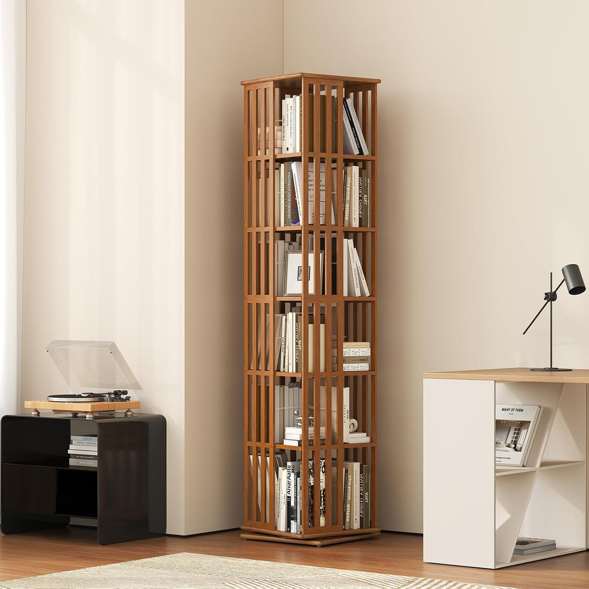 Bamboo spinning bookcase tower filled with books, placed in a corner of a living room