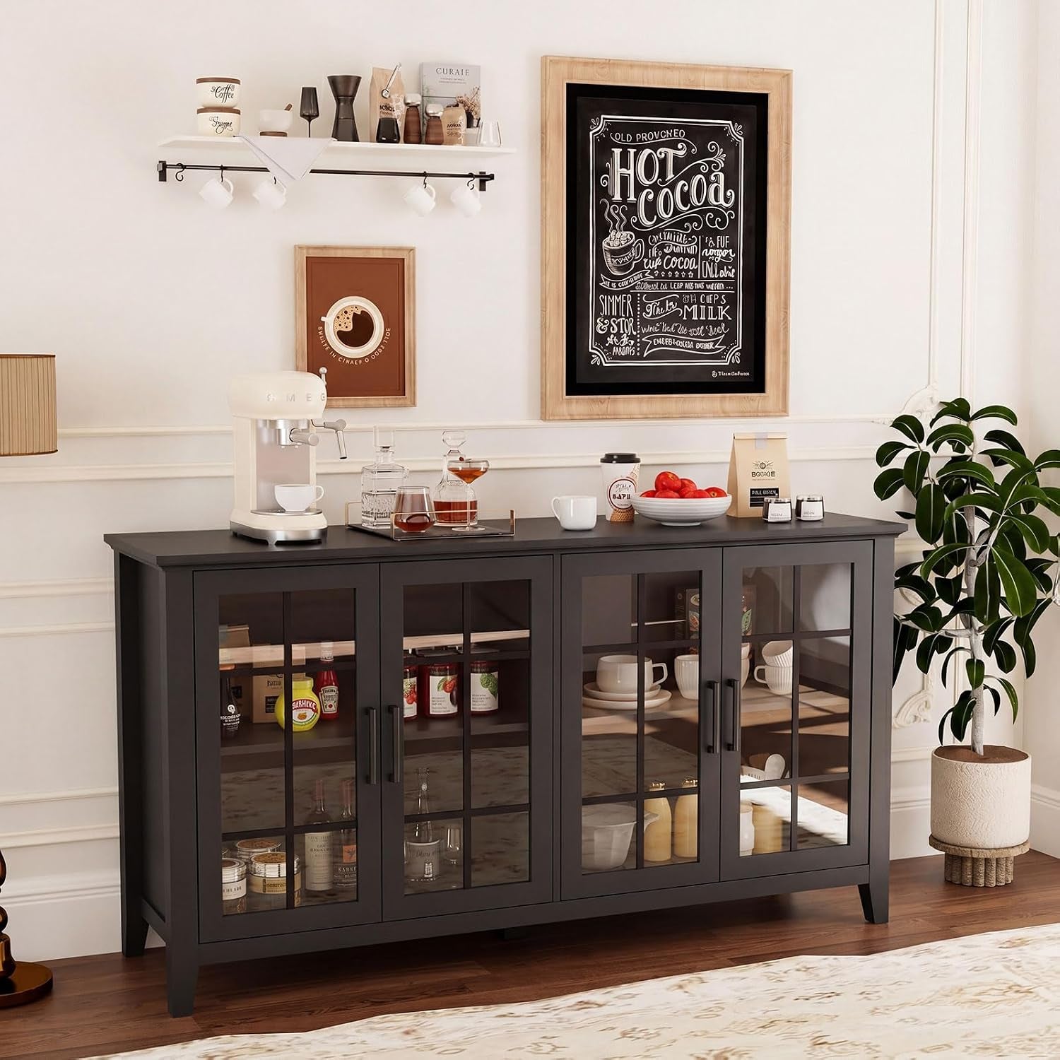 Black buffet cabinet styled as a coffee station showing glass doors and interior shelving with dishes and jars