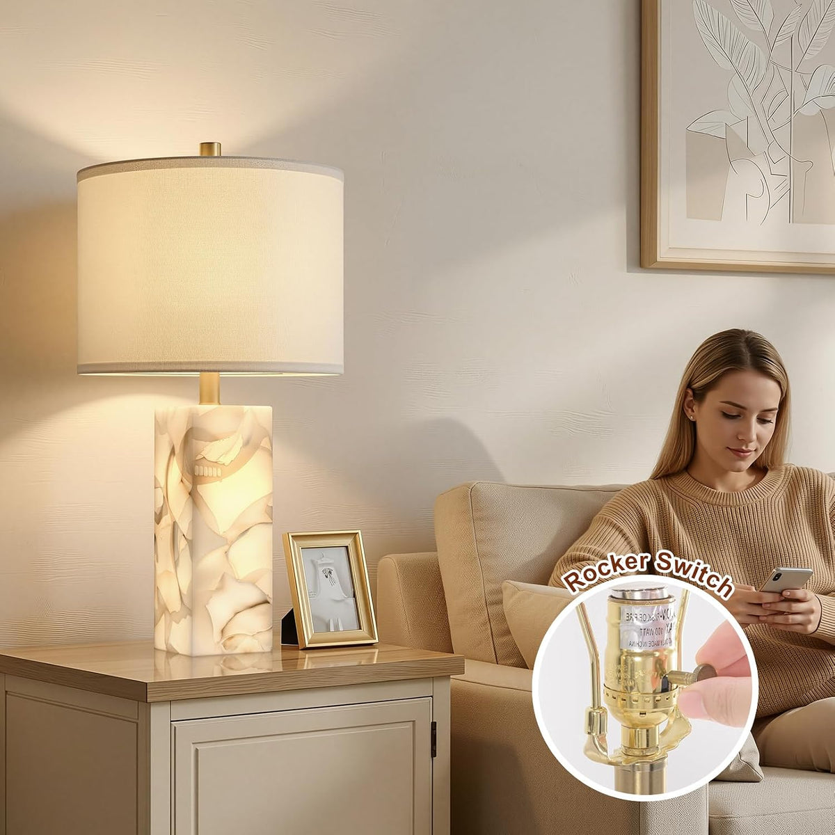 Alabaster column table lamp beside a sofa with inset close-up of the metal rocker switch control