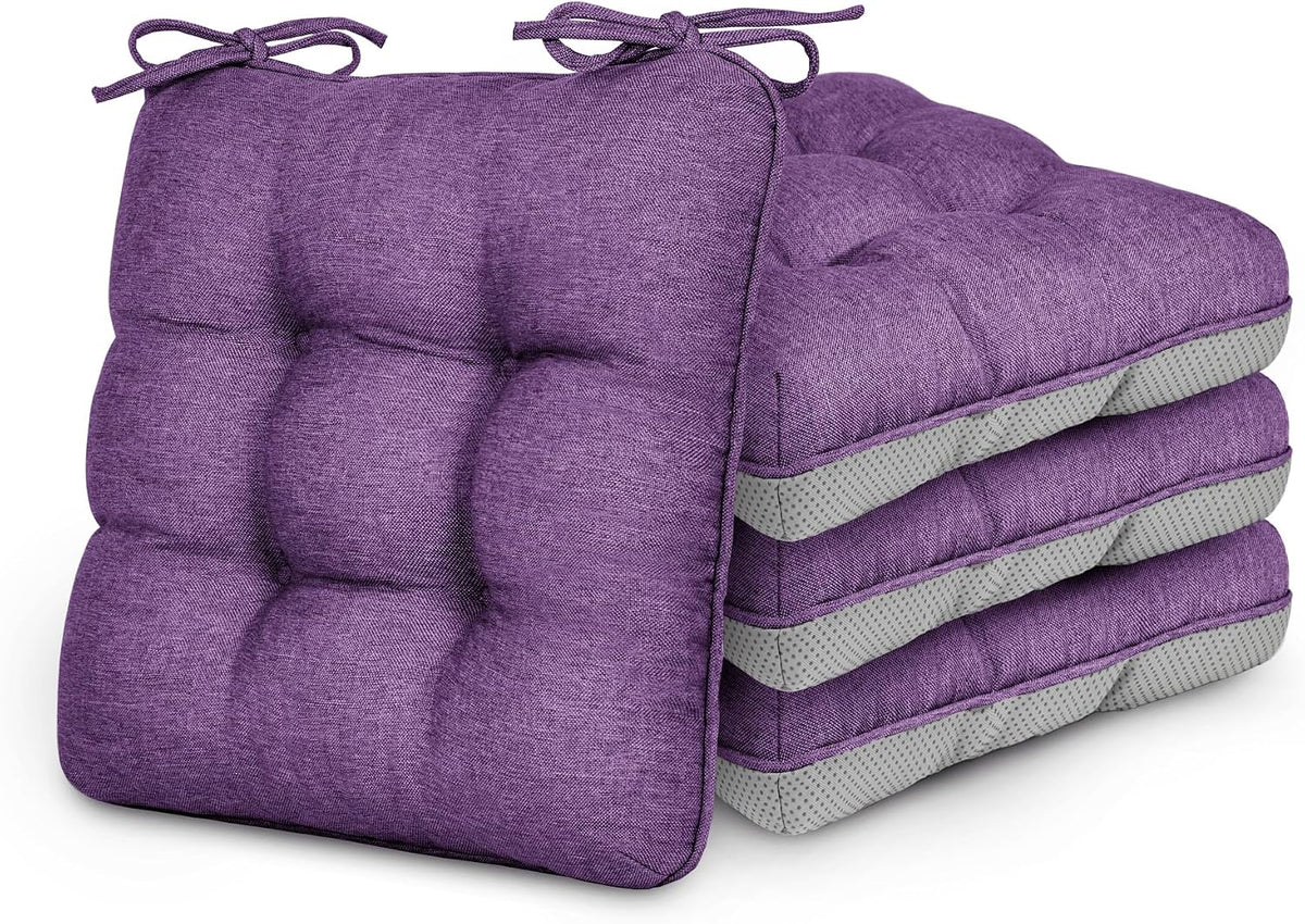Four stacked purple tufted chair cushions with tied straps visible on the front cushion.