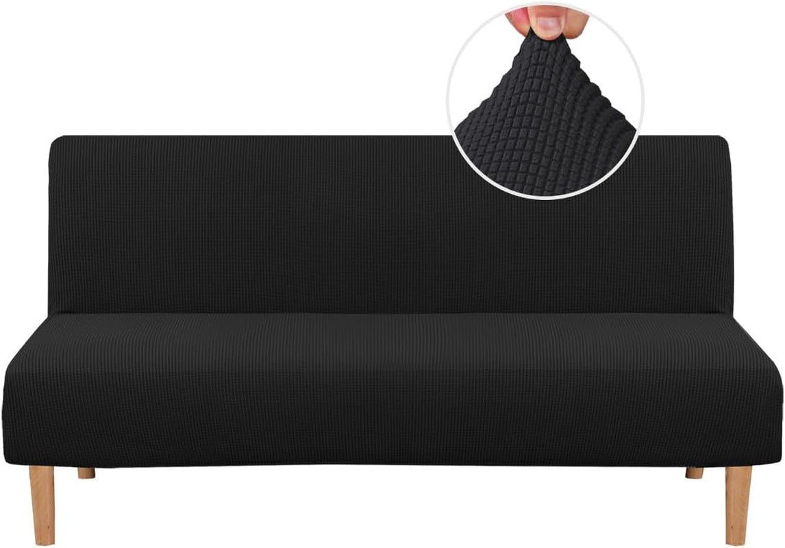 Front view of a black small-check textured slipcover on a futon showing wooden legs