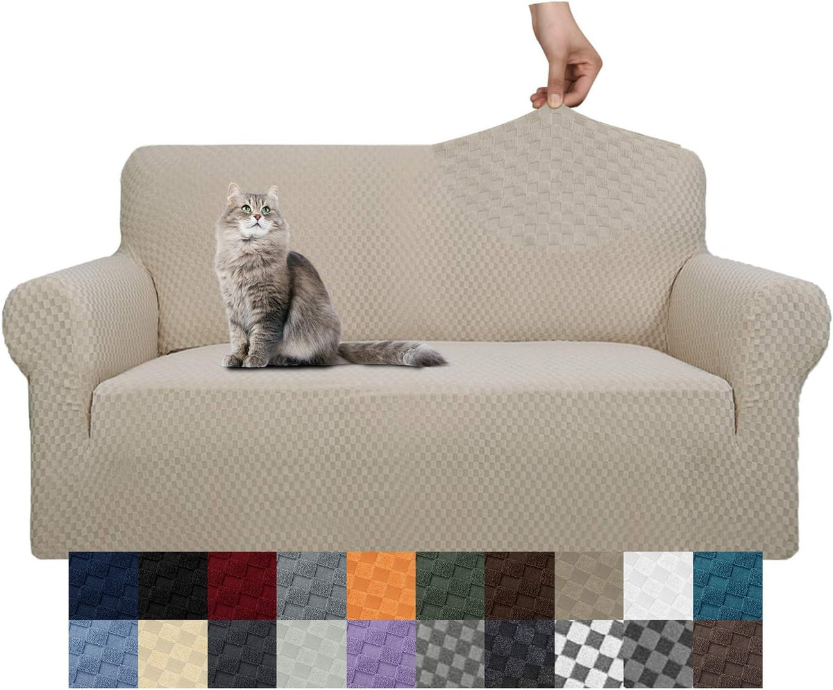Beige textured slipcover on a sofa with a gray cat on the seat and a hand pulling the back fabric taut.
