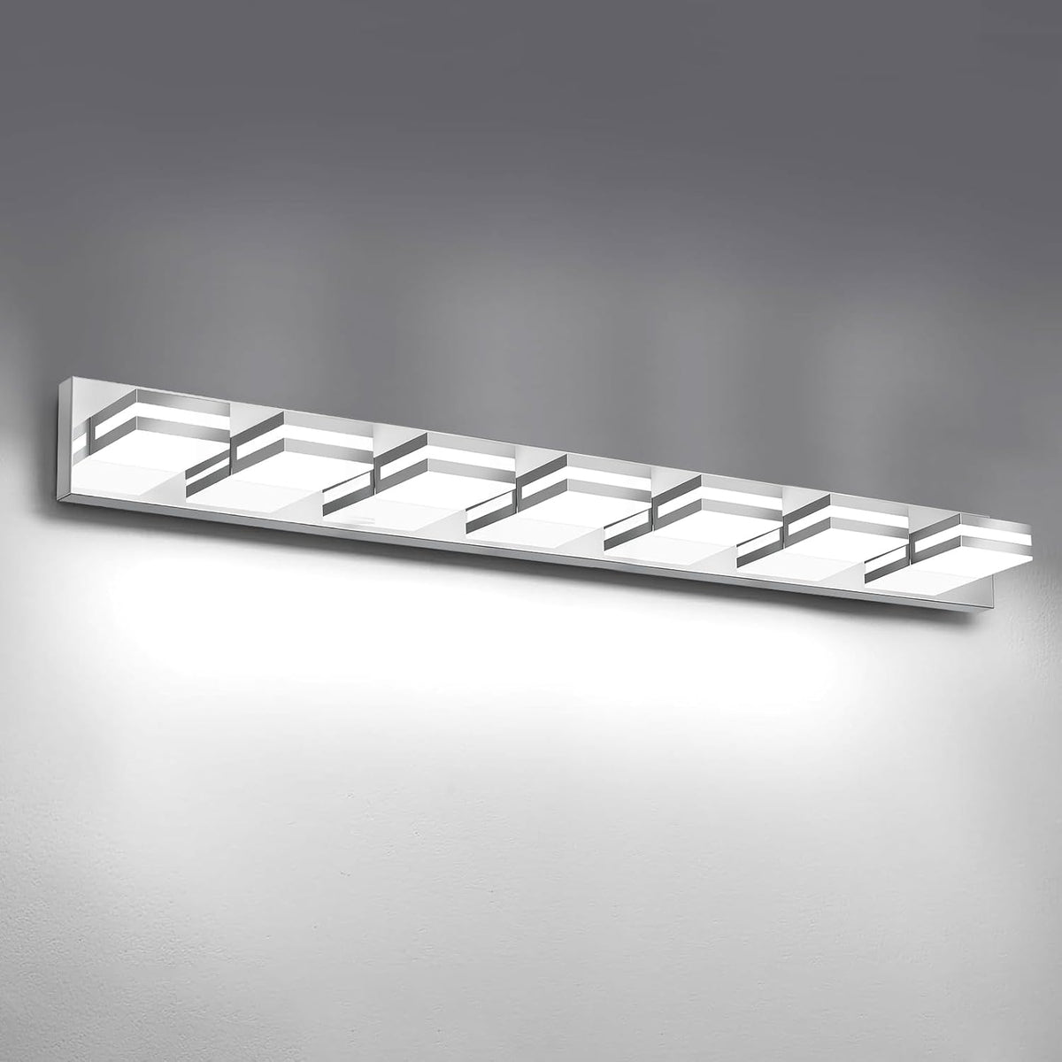 Angled close view of the silver LED vanity bar showing six stepped square light modules mounted on a wall.