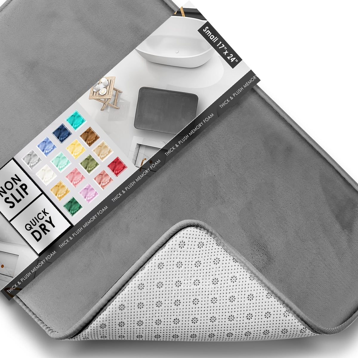 Angled close-up of a gray bath mat corner flipped to reveal dotted non-slip underside and a packaging color chart.