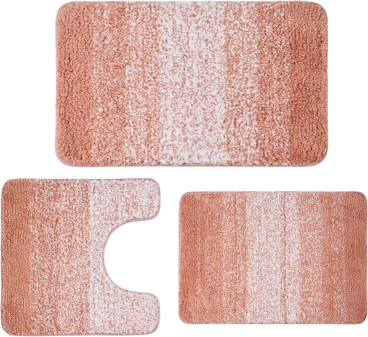 Three-piece bath rug set in a dusty rose to white gradient, shown flat with U-shaped toilet mat and two rectangles