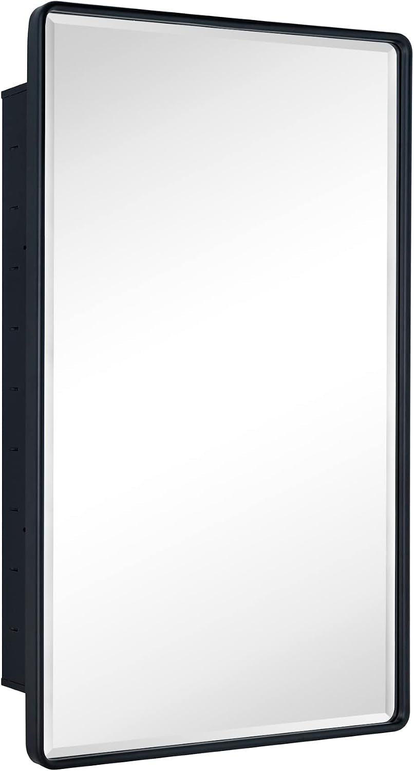 Angled front view of matte black mirror with rounded frame edge and visible mounting holes on the cabinet side.